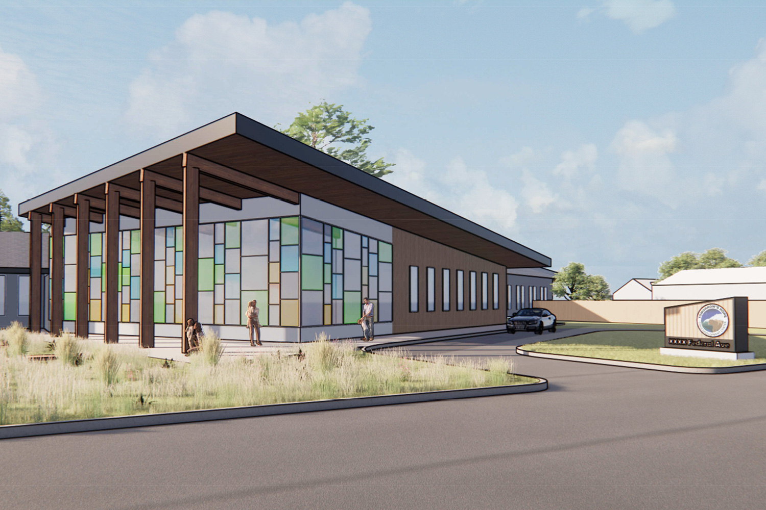 Rendering of the front of a large new daycare facility, with a sloped roof and driveway.